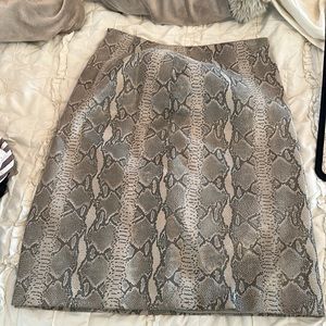 Fire gray leather skirt size 4 with sexy snake pattern.